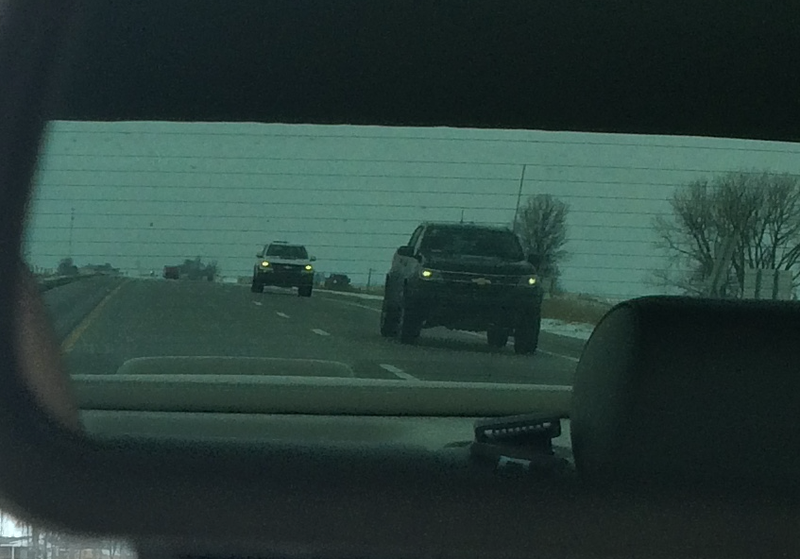 A black and a white ZR2 in my rear view mirror.